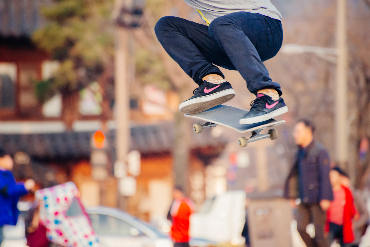 Korean skateboarder in the air