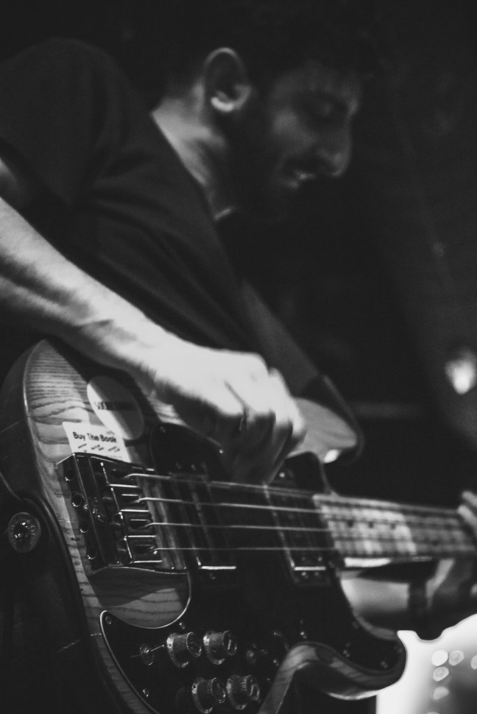 Man playing guitar in black and white