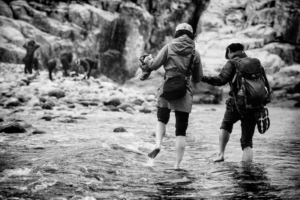 Women in water crossing in Korea