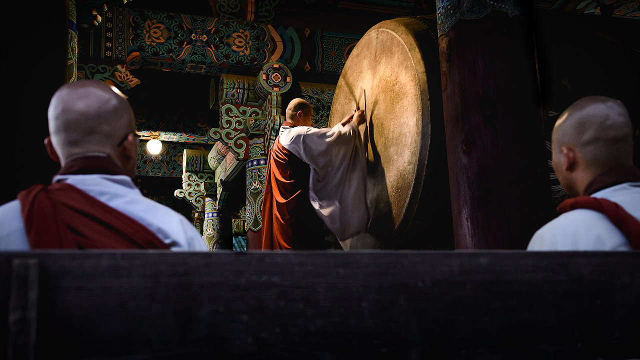 Buddhist monks watching a drum ceremony in South Korea.