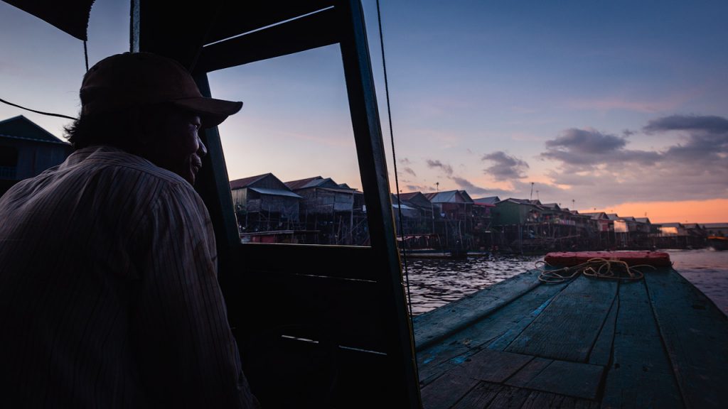 Boatman at sunset in Kampong Phluk