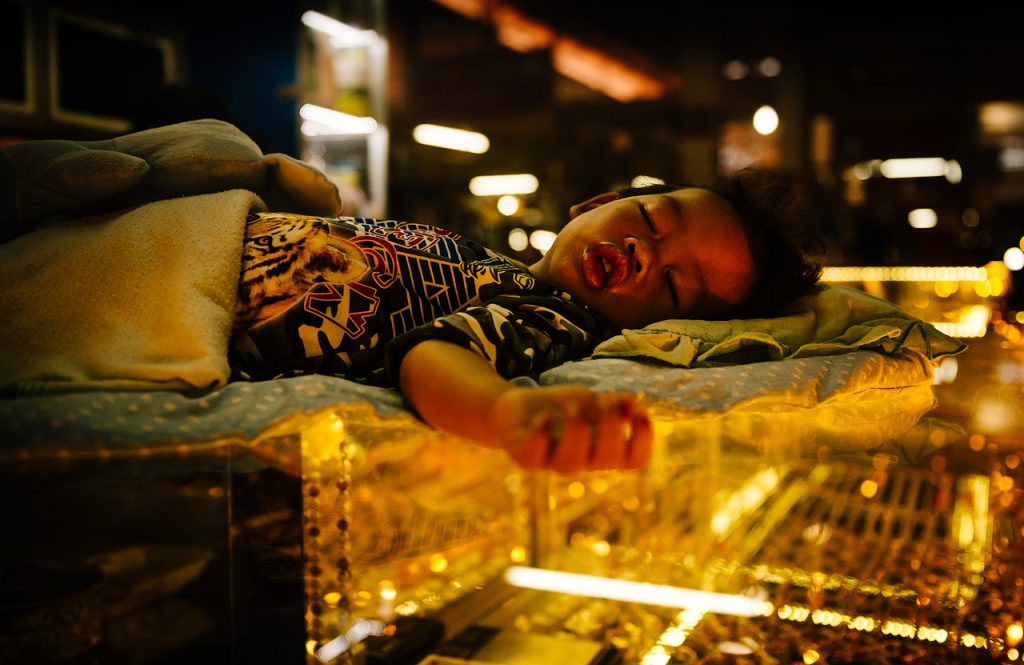 Sleeping boy at Psah Leu Market, Siem Reap