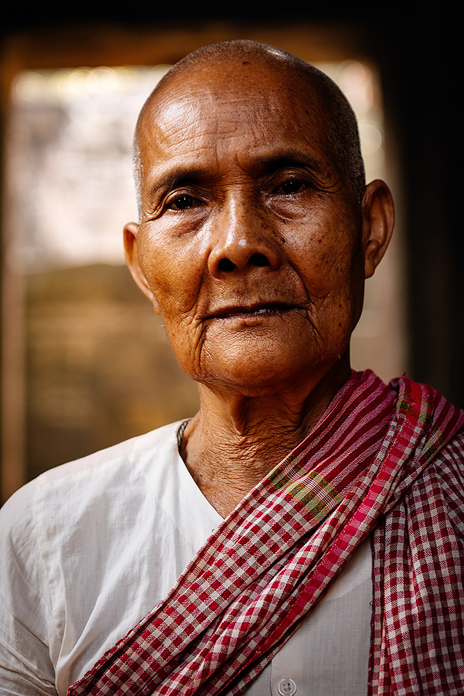 An elderly nun at Banteay Kdei temple in Angkor, Cambodia